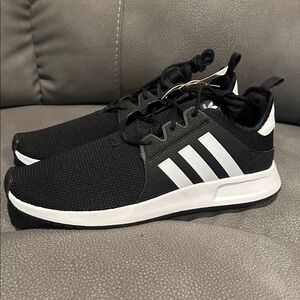 NWT Adidas basketball shoe.